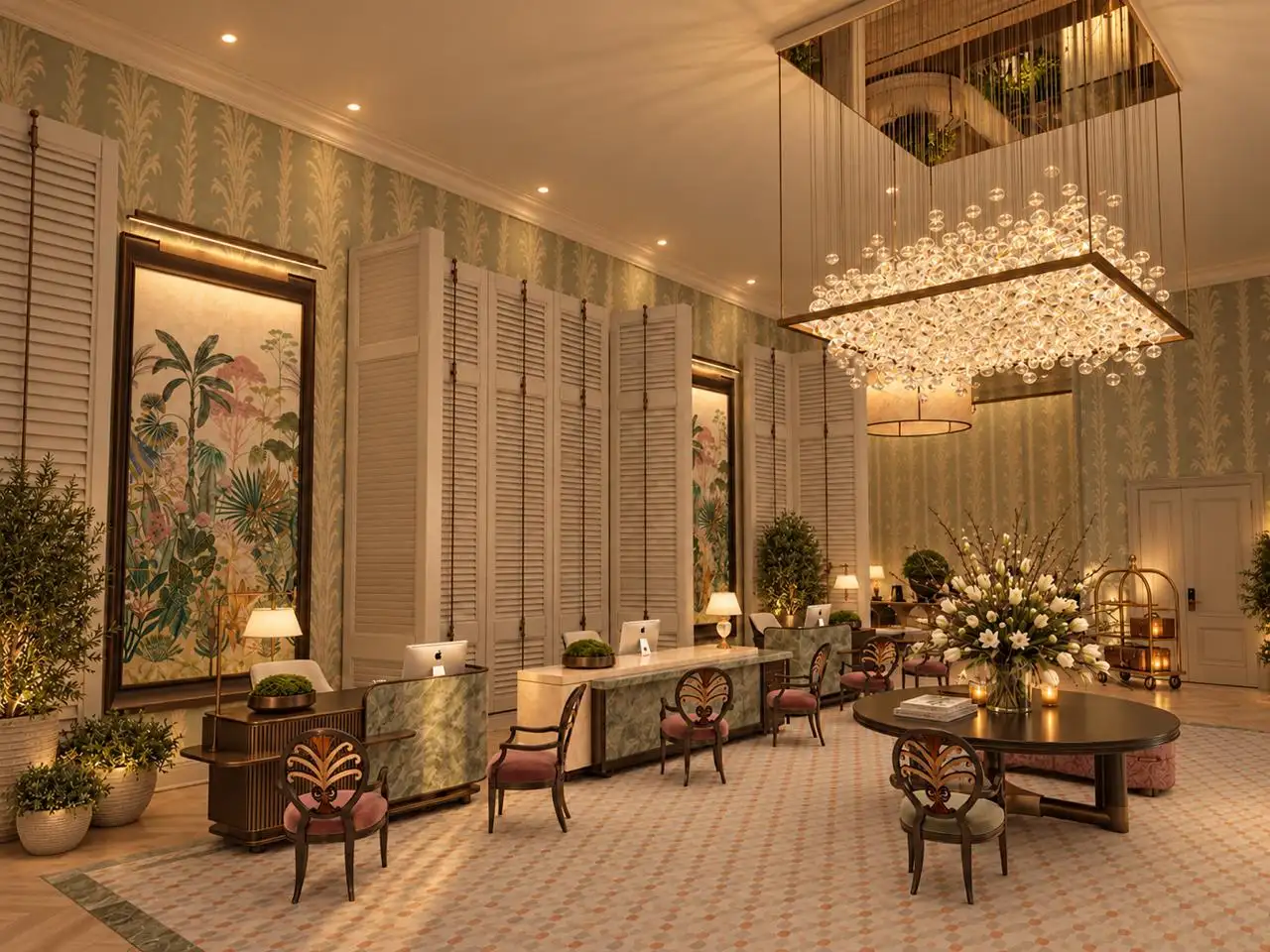 Lobby at night with a palm mural and crystal chandelier