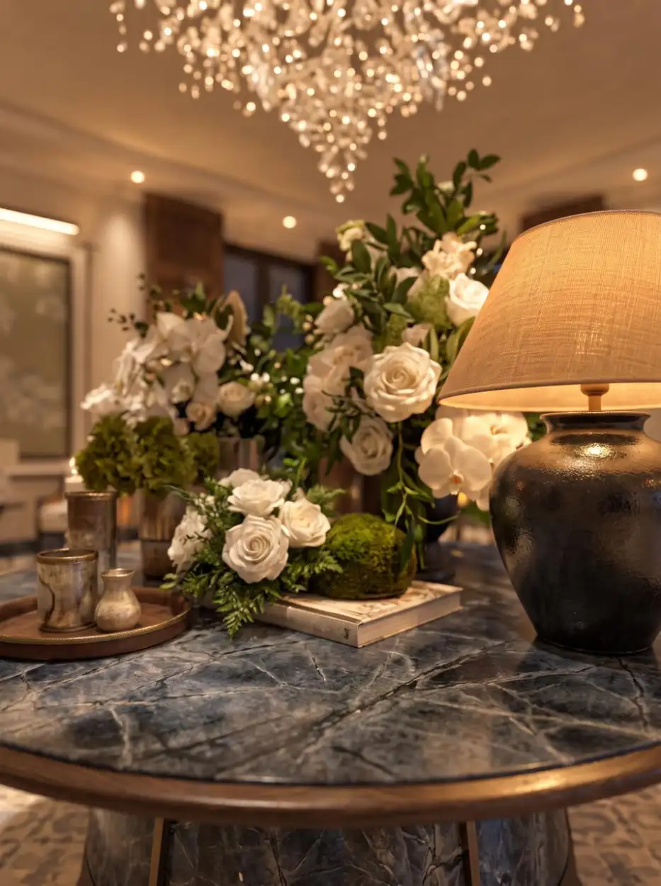 White roses and a lamp on a blue marble table